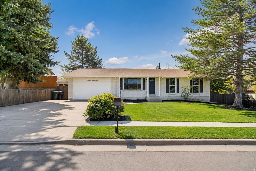 Completely renovated from top to bottom, this stunning rambler offers the perfect blend of modern design, quality craftsmanship, and an unbeatable east Sandy location. This home has been thoughtfully transformed with nearly every surface, system, and finish updated for today's lifestyle. Inside, you'll find a bright open-concept layout featuring all-new flooring, paint, trim, doors, lighting, hardware, and beautifully redesigned living spaces. The fully remodeled kitchen showcases custom white shaker cabinetry, quartz countertops, a large island, stylish black fixtures, updated backsplash, and new stainless appliances-creating a clean, modern aesthetic that flows seamlessly into the main living and dining areas. The spacious primary suite includes a fully renovated ensuite bathroom with a custom walk-in shower, designer tile flooring, updated vanities, modern plumbing fixtures, and a large walk-in closet with built-in shelving and space for a secondary washer/dryer hookup. Additional bathrooms throughout the home have also been completely updated with contemporary finishes and fixtures. Major improvements include new HVAC, new roof, updated plumbing and electrical, new lighting throughout, new windows, flooring, trim carpentry, interior and exterior paint, and extensive cosmetic and functional upgrades throughout. The oversized garage and storage areas provide exceptional flexibility and organization. This is a rare opportunity to own a truly turnkey, fully renovated home in one of Sandy's most desirable established neighborhoods.