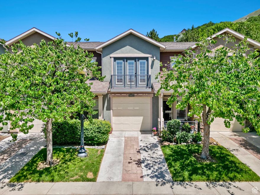 Welcome to this charming 2 bedroom townhome with a 1 car garage, perfectly nestled on the desirable East Bench of Draper, just moments from "Silicon Slopes," Utah's tech corridor. Fresh new carpet throughout brings a crisp feel to the light filled interior, where you'll find an open concept living space with a cozy fireplace and an inviting flow for both everyday life and entertaining.  The primary suite features an ensuite bathroom and a darling Juliet balcony, perfect for opening the doors to enjoy a breath of fresh air.  Enjoy the sweet curb appeal of a front porch garden, plus a cozy back deck ideal for summer evenings. The community offers a pool for sunny days and relaxing weekends, while the location places you just minutes from Bangerter Highway, I-15, IKEA, Harmons, and the growing attractions of Draper and nearby Lehi, like Thanksgiving Point, hiking trails, boutique dining, and many family friendly events.  This townhome blends charm, convenience, and lifestyle, right in the heart of it all. Square footage figures are provided as a courtesy estimate only and were obtained from county.  Buyer is advised to obtain an independent measurement. Buyer and Buyer's Agent to verify all information, which has been provided as a courtesy only. All information is deemed reliable but not guaranteed.