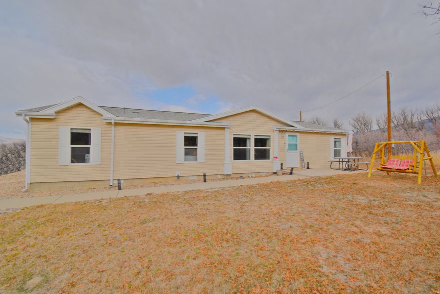 Welcome to this beautiful mountain living with year-round access on a 1.19-acre lot. This single level home offers an open, light, and bright floor plan with a beautiful kitchen and cozy wood burning stove. Enjoy plenty of outdoor space with front and back patios showcasing stunning views. Features include a New 30 yr. roof on the home and garage. Convenient access to the nearby golf course, pool, and clubhouse. Easy to show!