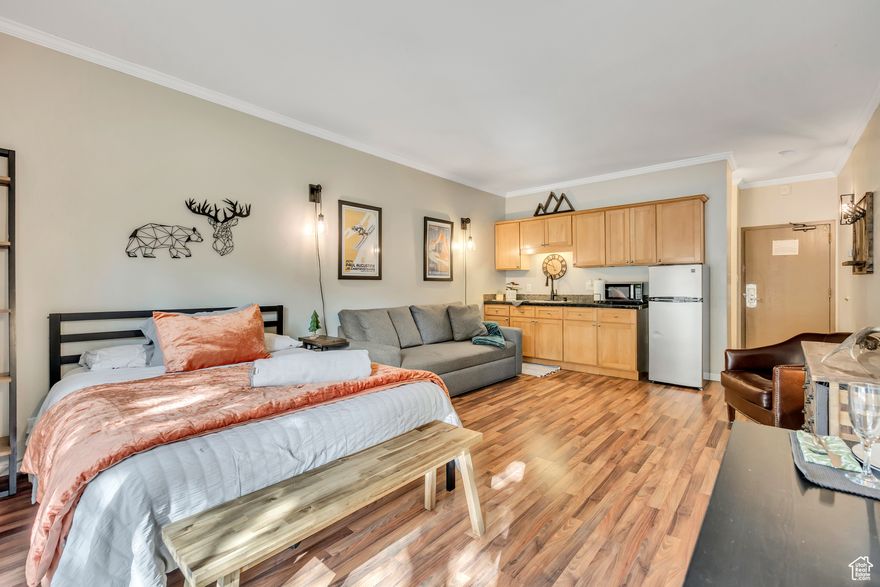 Charming Prospector studio in the Heart of Park City. The perfect mountain retreat or investment opportunity! This gem is ideally situated within the community, offering a private outdoor patio and convenient access to all amenities including the pool, hot tub, laundry facilities, individual bike storage and the front desk. The parking is also right next to the unit. Inside, the studio features slate tile floors in the entry and bathroom. Laminate wood flooring throughout the rest of the unit.  The kitchen has a larger refrigerator than typically found in studio units. The bathroom floors are pre-wired for radiant heat, adding comfort and value. Sold fully furnished and turn-key, this unit is ready for your personal use or as a short-term rental which is fully approved in the Prospector. The location can't be beat-steps from the Rail Trail, close to world-class skiing, dining, shopping, biking and hiking plus the free Park City bus route. A large private storage area next to the unit provides ample space for gear. Whether you're looking for a weekend getaway, income-producing property, or full-time residence, this beauty offers exceptional value, convenience, and comfort in one of Park City's most popular neighborhoods.