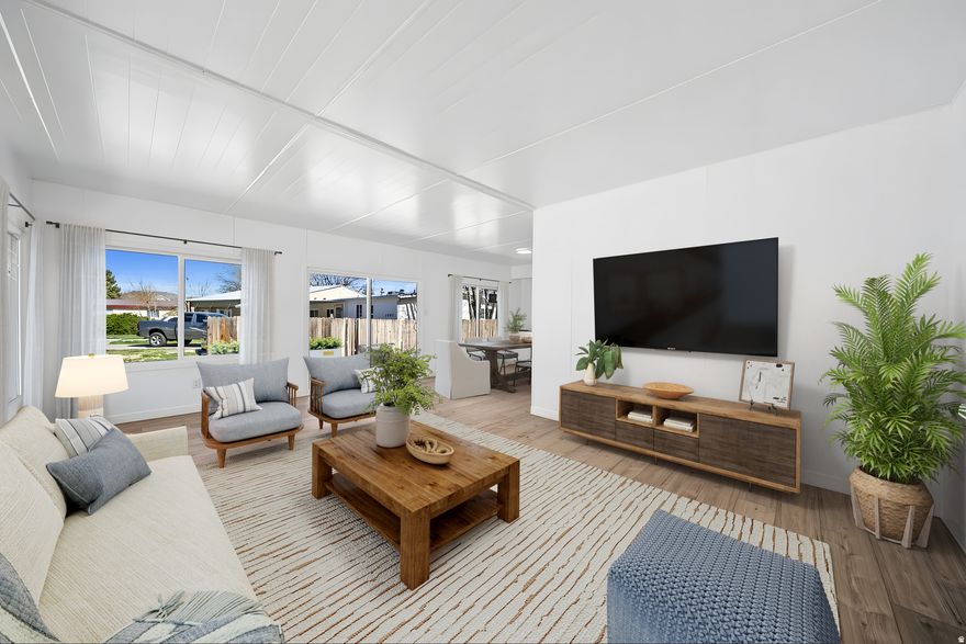 LAND IS OWNED: Recently remodeled home with updates including new kitchen, bathrooms, windows, doors, flooring, interior and exterior paint, counters, appliances, carpet, partial electrical and plumbing work, landscaping, and more. It has 2 large bedrooms and a good-sized living area with big windows for plenty of natural light. Outside there's a deck and patio with mountain views, a large driveway leading to an oversized 2-car detached garage, plus a carport for extra parking and room for an RV. The yard is small but has potential, with grape vines along the side. Seller has lender available for mobile home applications and approvals if needed please reach out. Square footage figures are provided as a courtesy estimate only and were obtained from measurements.  Buyer is advised to obtain an independent measurement.