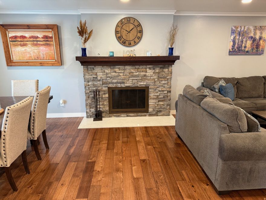 Absolute gorgeous home with amazing updated features beginning as you walk through the beautiful front door. Stunning solid hickory flooring, Roof, rain gutters with leaf guard, windows, air conditioner, tankless water heater, lighting, flooring, quartz countertops, farm sink, recessed lighting, pendant lighting, and much more. Home is located in a secluded setting on .45 acre lot. Huge garden area, tons of parking, basketball standard. Fire pit. Oversized garage. Updated rock on chimney. Open floorplan with great room. Kitchen Island with farm sink, gas range. Stainless refrigerator, microwave, and dishwasher, in addition to the washer and dryer all included. Large master bedroom. Basement offers additional large bedroom. Wood burning stove, laundry room/storage. Cold storage room.