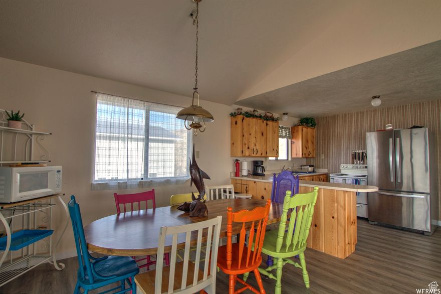 Price REDUCED $50,000!  Welcome to your dream mountain retreat, located in beautiful St Charles, Idaho. Nestled in a gated community with stunning mountain and lake views, this 2492 sq ft home offers the perfect blend of comfort, recreation, and year-round access. This spacious property features four bedrooms, two bathrooms, and two covered decks - ideal for taking in the fresh air and incredible scenery. Cozy up by the wood-burning stove after a day of outdoor adventure, or gather with family and friends in the inviting living area.  The home is just a short walk to the lake and within minutes of a semi-private the East Shore Marina, making it effortless to launch or rent watercrafts for your next day on the water. You'll also enjoy exclusive access to brand new pickleball courts, a large grassy common area, and everything this highly sought-after subdivision has to offer. Whether you're looking for a full-time residence or a vacation getaway, this home checks all the boxes! SELLER FINANCING AVAILABLE!!!! 20% down at 7% interest rate.