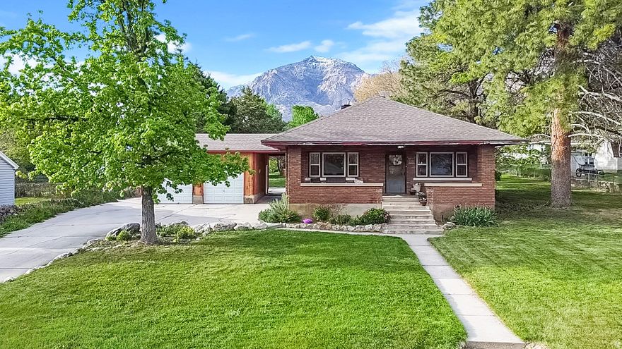 Fully remodeled home in North Ogden with incredible views of Ben Lomond and a .59 acre south facing lot. Inside has a great feel with updated finishes and a mix of hardwood, tile and carpet.  Comes equipped with fridge, stove, microwave and dishwasher. Move in ready. Big deck for hosting and relaxing. Detached garage and outbuildings with a full Sprinkler System. The yard is full of mature trees, pines, fruit trees, and a vegetable garden. Tons of space and privacy. Located in a great area with highly rates schools, this is a solid option if you're looking for something update with land and views.   Square footage figures are provided as a courtesy estimate only and were obtained from Weber County .  Buyer is advised to obtain an independent measurement.
