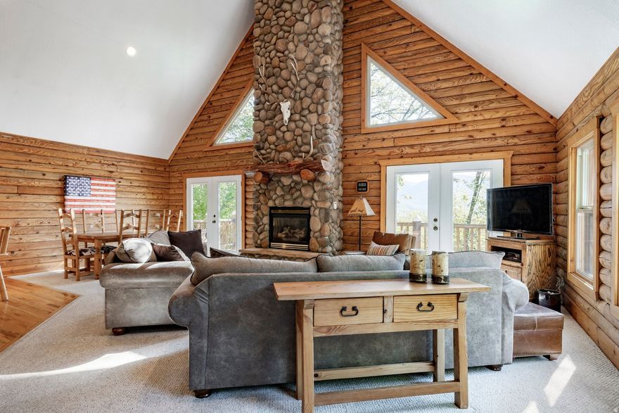 Rarely does this opportunity arise - to own a legacy Spring Mountain property that has been a family gathering place for generations. Nestled on 1.48 acres, this lovingly maintained cabin is the basecamp for outdoor enthusiasts that want to be far enough away, yet close to all Ogden Valley has to offer.   As you enter this gated enclave, you are greeted by the resident pair of swans and wading blue herons in the private pond and spring fed stream guiding you up the private lane to your cabin.   Once inside there is a dramatic, cozy two story stone fireplace surrounded by windows showcasing a wide view of the Ogden Valley. Entertain in the inviting open floorplan or dine al fresco on the wrap-around deck. Enjoy games and activities in the lower level family room, and exercise room.   Curl up in front of the fireplace after a day of skiing Utah's fresh powder, swimming or paddle boarding in the private pond, or hiking one of the numerous trails outside your door.   Located minutes from Powder Mountain, Snowbasin and Nordic Valley.  Sold Fully Furnished with some exclusions  Listing includes Parcel # 22-026-0018, .76 Acres, and parcel # 22-260-0019, .72 Acres for a total of 1.48 Acres