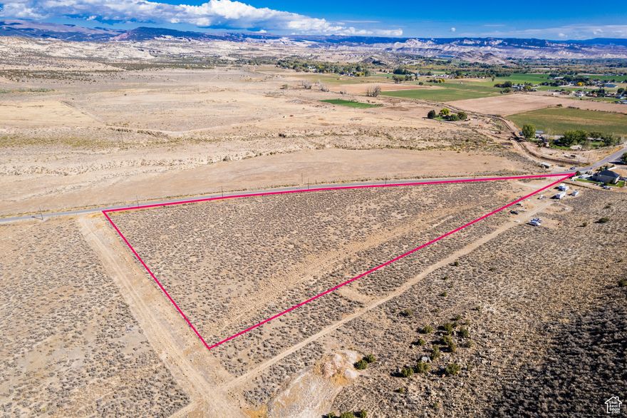 Discover 9.6 acres of opportunity in the heart of Maeser! Located at approximately 4075 W 1500 N, this property offers an impressive 1,380 feet of frontage along 1500 North, providing excellent accessibility and visibility. The land is well-suited for a variety of uses-whether you're looking to build your dream home or subdivide. With its convenient location just minutes from Vernal, you'll enjoy the peaceful feel of country living while still being close to schools, shopping, and community amenities. Wide-open views of the Uintah Basin add to the charm, making this a rare piece of acreage. Buyer and buyers agent to verify all information.