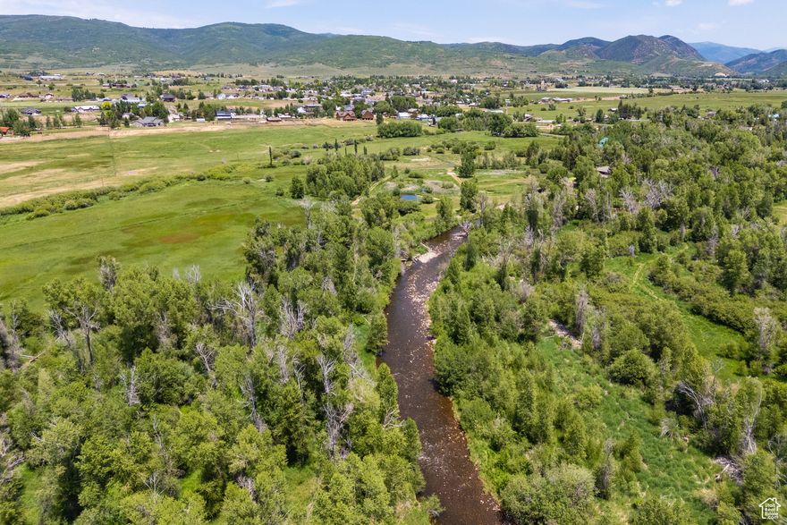 Extraordinary 20+ acre level homesite boasting over a quarter-mile of Weber River frontage accessible via a private gated road. Here, the river doesn't just border the land, it winds through it creating an unmatched sense of connection to the water and the landscape. This incredible property provides the ideal canvas for your dream farm or equestrian retreat, with wide-open space, natural resources, and a setting that inspires. Walkability to the Oakley Diner and Ken's Kash Market blends tranquility with convenience. Whether casting a line in one of Utah's premier fly-fishing destinations, unwinding along the riverbank, or simply taking in the peaceful beauty of your surroundings, this property offers a lifestyle that feels both serene and alive. Imagine pastures and stables, a riverside ranch, or simply a place to slow down and connect with nature- this Oakley gem offers endless possibility in a truly one-of-a-kind location where river, land, and sky meet in harmony.