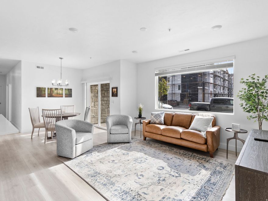 Enjoy easy, single-level living in this spacious main-level condo featuring 9-foot ceilings and an open, inviting layout. The bright kitchen flows seamlessly into the family room and entry, creating a comfortable space for everyday living and entertaining. Convenient direct access from the attached garage means no stairs and effortless entry. Ideally located near I-15, FrontRunner, shopping, and dining-this home offers both comfort and unbeatable convenience.  Furniture negotiable with sale.