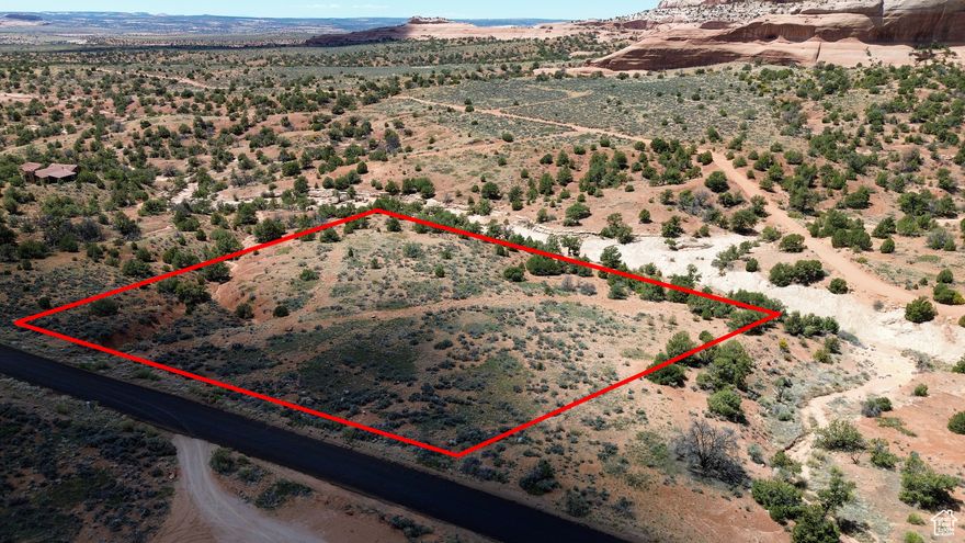 Spectacular 2.6-Acre Lot in Wilson Arch Resort Community Nestled in the heart of red rock country, this parcel offers sweeping panoramic views of Wilson Arch, the Abajo Mountains, and dramatic desert cliffs. Located just 30 minutes south of main street Moab, this property combines natural beauty with modern convenience.The land features unique rock formations, mature pinyon and juniper trees, and wide open space-ideal for building a peaceful retreat, vacation home, or investment property. Enjoy easy access to nearby public lands, hiking trails, and world-renowned national parks like Canyonlands and Arches. Utilities are stubbed for: power, high-speed internet, and shared well water. Whether you're dreaming of a desert escape or looking for your next smart real estate move, this lot in the Community is a rare opportunity to own a piece of Utah's stunning red rock landscape. Lot lines marked with surveyor stakes and orange reflective 4ft poles.