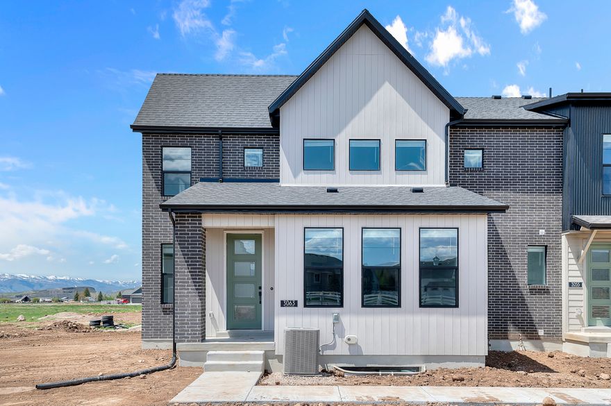 This thoughtfully designed Hovden townhome is located in a great Francis community! Features include a beautiful kitchen with gray maple cabinets, quartz countertops, tile backsplash and stainless steel gas appliances. Flooring includes a stylish blend of laminate hardwood, tile, and carpet throughout. The owner's bathroom offers quartz shower surrounds and bold black matte hardware for a modern touch. Additional highlights include a sleek metal railing at the stairway, a finished basement space and upstairs loft perfect for extra living or entertaining. Comes fully landscaped for hassle free living!