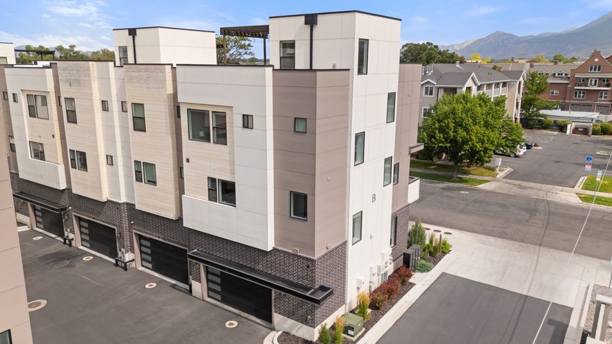 Live the highlife! Great Short Term Rental history! All current nightly rentals & Reservations can/will be transferred to new owner! This is a rarely offered roof-top patio unit that lives large with a natural gas fire pit & hot tub extend living space, providing exceptional year-round views of Mt Timpanogos & "Y" Mountain. Re-live game-day memories as you look out to view Lavell Edwards Stadium through your windows & Roof-top patio! Located in the heart of all Provo City Center amenities. This home has 9' Ceilings, beautiful White Oak plank hardwood flooring, a cozy 36" Gas Fireplace with full brick surround & tasteful architectural details. Exceptional finishes include board shiplap, white oak ceiling beams, craftsman kitchen cabinets w/ brushed gold hardware, large central Island, quartz countertops, tile backsplash & Bosch appliances w/ gas cooktop & double wall ovens. Attention to detail is everywhere. Enjoy a spa quality primary suite, featuring white oak ceiling beams & dreamy oversized, free standing soaking tub, frameless glass step-in shower & spacious walk-in closet. The adjacent 2nd Bedroom also has an en-suite bath. First level bedroom features bunk-beds for lots of fun. Being sold FULLY FURNISHED.