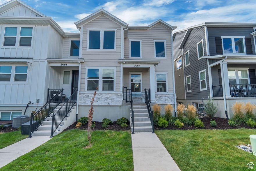 Prime location townhome with almost 2300 sq ft with spacious living room featuring 2 story ceiling! Three bedrooms, 2 and 1/2 baths with laundry (washer and dryer are included) on the 2nd floor. No construction delays here, ready to move in! Living room has beautiful wood floors. Kitchen features painted green cabinets and white quartz countertops, Bespoke Samsung Refrigerator (interchangeable panels, currently white) is included. Primary suite has a walk in closet, double vanity and walk in shower. Basement can be finished into an additional living room, bedroom and bath room.  Access to the community pool, pickle ball courts, play ground, club house and dog park. Prime location off of 2100 S easy access to freeways, and Lehi Front Runner Station. Also minutes from Ascent Academy, Primary Children's Lehi Campus and Lehi Recreation Center (as a resident of Lehi you'll get discounted passes to Lehi Rec). Parking in a private two (2) car garage with alley access and ready for electric vehicle charging.  Schedule your tour today!