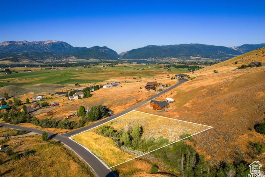 Elevated Expansive Views of the Ogden Valley and Wasatch Mountains. This Private Community is approx 2 miles from Pineview Reservoir & just minutes from both Snow Basin and Powder Mountain Ski Resorts.  Stream is seasonal.