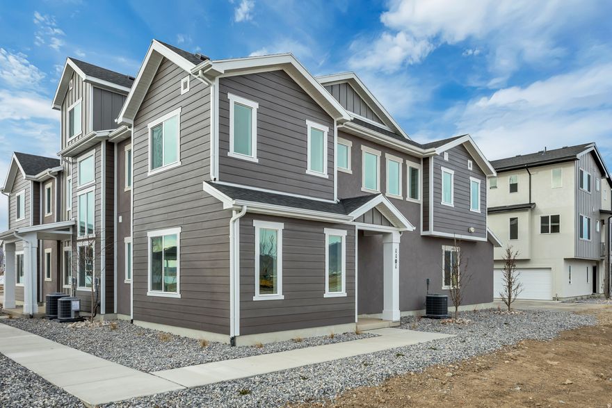Experience modern comfort and style with the Buchanan townhome in the sought-after Harmony Place community in Salem. The kitchen is a chef's delight, featuring premium stainless steel gas appliances, quartz countertops, 42" upper cabinets, and stylish pendant lighting over the island. The spacious primary suite offers a dual-sink vanity with quartz countertop, a shower/tub combo, and a private door at the bath. Bath 2 is equally well-appointed with an undermount sink, quartz countertop, and a shower/tub combo, while the powder room features a classic pedestal sink. Enjoy 9' ceilings on the main floor, elegant railing on both levels, pre-plumbing for a future water softener, and an 8' garage door with keypad access for added convenience. Located in a vibrant community with parks, walking trails, and planned amenities, the Buchanan townhome offers both style and function in an ideal Salem location.