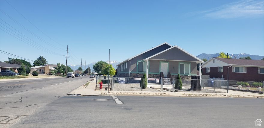 Impeccable Rambler combines comfort and functionality in one of the most prime areas of Spanish Fork! Home is distinguished by a spacious and bright open-concept. Features 5 bedrooms and 3 full bathrooms. Yard is fully fenced, with dedicated pet area, lot of parking and a RV space. The finished basement with separate entrance, offer a Mother-in-Law or Rental Income space. The investment potential is unique! Location is unbeatable: steps from schools, shopping centers,, with quick access to major highways for quick and easy commute. Don't miss out on this excellent investment and living opportunity! Schedule your visit with the agent today, and fall in love with all the possibilities this home has for you. Buyers are advised to perform their own measurement verification.