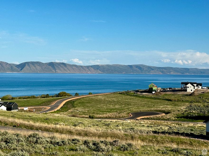 VIEWS of Bear Lake from this building lot! The Reserve at Bear Lake offers a beautiful clubhouse with fitness room, two pools, hot tub, splash pad, sports court, playground, BEACH ACCESS and access to Fish Haven Canyon for ATV/UTV, snowmobiling, snowshoeing, hiking and mountain biking. This lot is accessible year round, all utilities stubbed, paved road.  Ready to build on! Nightly rentals allowed.