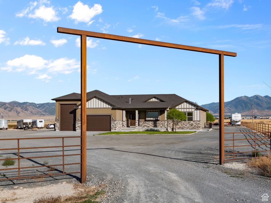 Price Reduced!!! Come enjoy this beautiful horse property in Erda - come Ride your horses and enjoy this property that is only 30 minutes to Salt Lake, 25 minutes to Salt Lake City International Airport when driving on the New Mid Valley Highway. This home has 5 bedrooms, 3 bathrooms and 2 laundry rooms. 1.45 Acre Ft. of water with more water available to purchase. 3.05 acre property and arena has a 5 rail steel fencing with an automatic horse waterer, equipped with really nice roping and riding arena with sprinkler system to eliminate dust. This is a perfect horse property. Has 30 amp RV plug and RV garage. The basement can possibly be used as ADU with its own entrance and furnace and A/C. Enjoy the beautiful views from any where on the property. Far from city noises but close to Tooele and Salt Lake City, this property offers the best of country life. Square footage figures are provided as a courtesy estimate only and were obtained from County records . Buyer is advised to obtain an independent measurement.