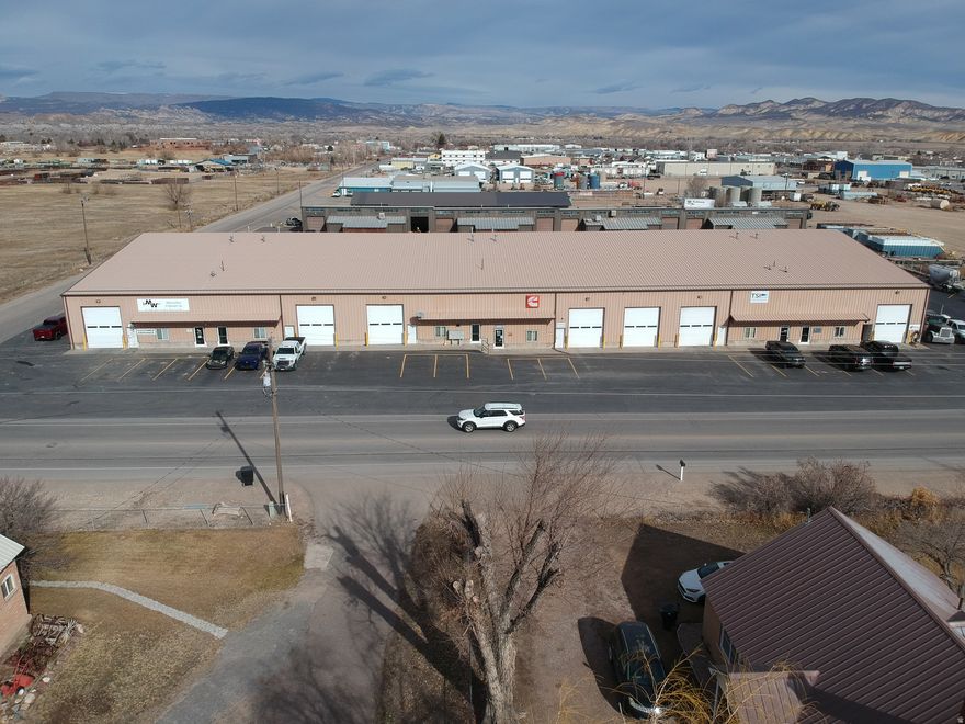 This well maintained 5 Unit Commercial Industrial building is located just  to the northeast of the Vernal Regional Airport.  This property would make a great addition to your investment portfolio.  It is approximately 37,050 SF  Each unit has an office with a dedicated glass door entrance.  Each unit has 12'x14' overhead doors and an entry door to the shop area. This building has had some recent updates.  Asphalt parking lot was sealed and striped in 2025.  New LED light fixtures throughout in 2014.  Ice/snow break along with new gutters/downspouts/heat tape and French drain was installed 2015. This building was designed originally to be 12 units.  There is also an extra bay that has been used by the owners that can be rented in addition to having 12 units.  So there is a potential for change.  Talk to listing agent about this for more details.   The industrial building next door is also for sale by the same owner.  See MLS# 2136295 for more details.  Buy one building or buy both! Qualified buyers/investors call the listing agent at 385-255-6829 with regards to rents and any questions.  Buyer is required to verify all information provided in this listing or by the listing agent.  Information sourced from county records and appraisal.  Seller and agent are related.