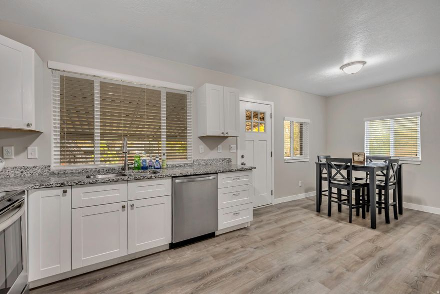 Welcome to this charming all-brick home in Ogden, Utah, offering a cozy retreat with modern updates and versatile living spaces. With a total square footage of 2,072, this residence features 3 bedrooms and 1 full bath upstairs, complemented by a 3/4 bath in the basement for added convenience.The basement boasts 3 den rooms that can be customized for various uses, providing flexibility for your lifestyle needs. The laundry is conveniently located in the basement for ease of access. Gather around the fireplace in the family room for cozy evenings and relaxation. The updated kitchen and bathrooms add a touch of contemporary style to the home, while the LVP flooring throughout offers durability and easy maintenance. Situated on a corner east-facing lot, this property enjoys abundant natural light and a sense of privacy.Explore the convenience of living close to shopping, hiking trails, and a variety of restaurants in every direction. The detached one-car garage provides additional storage space and parking. Built in 1949, this home combines classic charm with modern comforts, offering a unique opportunity to own a piece of Ogden's history.Don't miss the chance to make this delightful property your new home sweet home! Buyer is advised to get independent measurements.