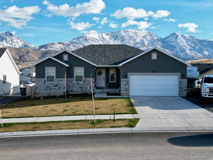 The Nebo floor plan offers practical living. Built in 2024, this home has been well cared for. LVP flooring throughout the main living space with carpet in the bedrooms. The front yard has been landscaped and the back awaits your finishing touches. The unfinished basement provides plenty of room to grow. Santaquin has all of the charm of small town living while being close to shopping, dining, and entertainment. Located close to several canyons including Payson Canyon and the scenic Nebo Loop. Schedule a walk through today!