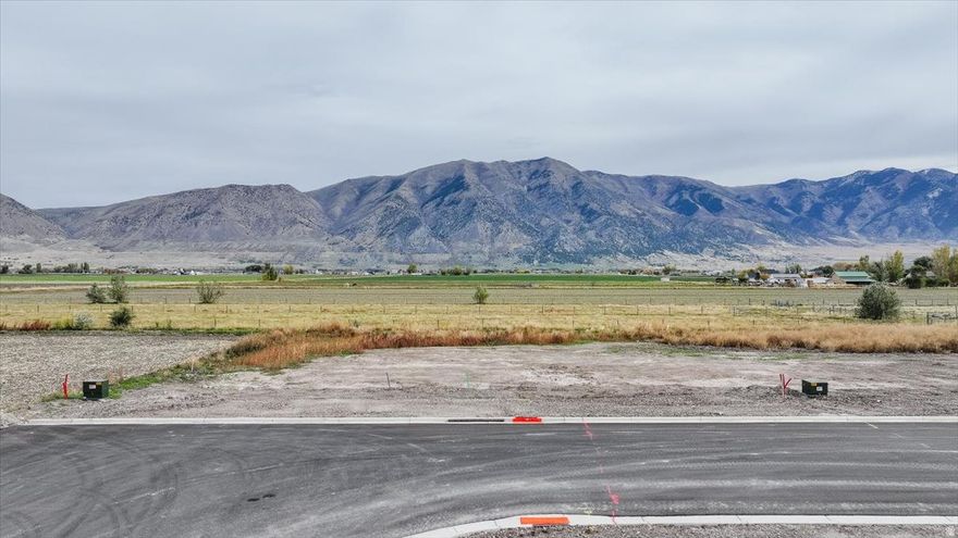 Beautiful lot available in a new subdivision in Elwood, Utah. This lot is builder-exclusive with Cedar Ridge Homes, and the purchase price will be applied toward your build cost. Choose from a variety of floor plans and design options to create the home that's perfect for you. Great location in a quiet, growing area with easy access to nearby amenities. Don't miss this opportunity to build your dream home with a trusted local builder.