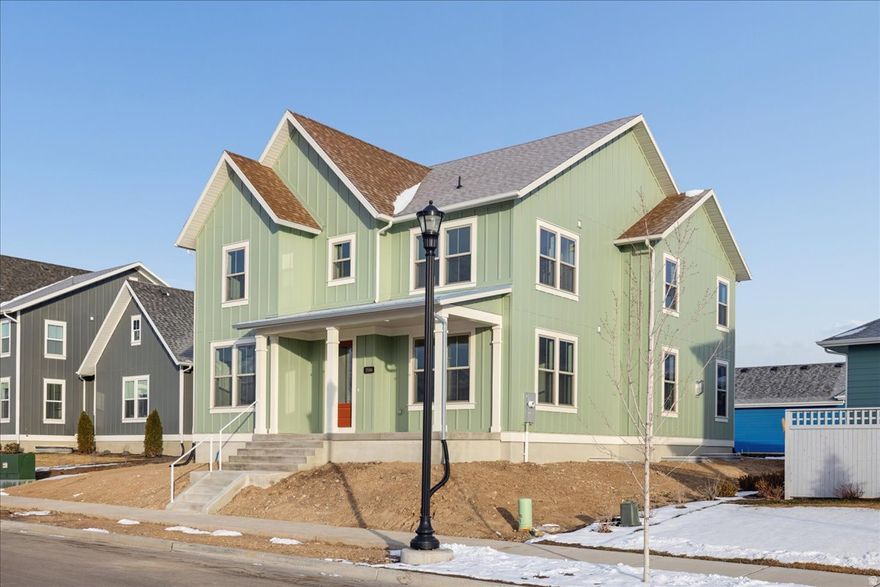 Introducing the Ridgefield Farmhouse at Cascade Village-where modern function meets timeless charm in one of Daybreak's most desirable neighborhoods near the Watercourse. Part of the exclusive Traditional Collection, this thoughtfully crafted home features a spacious open-concept design that seamlessly connects the kitchen, great room, and dining area for both everyday living and effortless entertaining. Just off the entry, enjoy a cozy sitting room and a versatile flex space-perfect for a home office, study, or playroom. The luxury owner's suite offers a private retreat with an oversized walk-in closet and elegant finishes, while a tandem 4-car garage with side door provides ample room for vehicles, storage, or even a home gym. With its expansive covered front porch, inviting curb appeal, and elevated design, the Ridgefield Farmhouse delivers flexibility, style, and comfort right in the heart of Daybreak's Cascade Village.