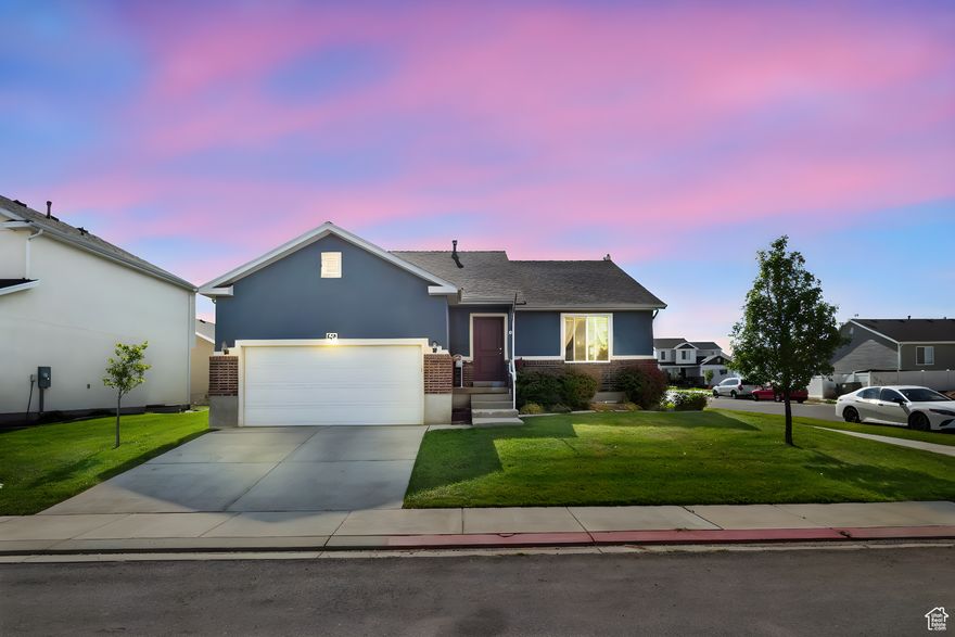 Welcome to this beautifully maintained 3-bedroom, 2-bath rambler with an unfinished basement.  located in the heart of Santaquin! Situated on a desirable corner lot, this home offers comfort, convenience, and modern style all in one.  Step inside to enjoy vaulted ceilings and laminate flooring that add warmth and spaciousness to the open-concept living area. The master suite features a private bath and ample closet space, perfect for relaxing after a long day.  Enjoy the ease of main floor living, with all bedrooms, bathrooms, and laundry conveniently located on one level. The home also includes a 2-car garage, offering plenty of storage and parking.  Centrally located, you're just minutes from schools, parks, and local amenities-making this an ideal spot for families or anyone looking for a quiet neighborhood with great access.