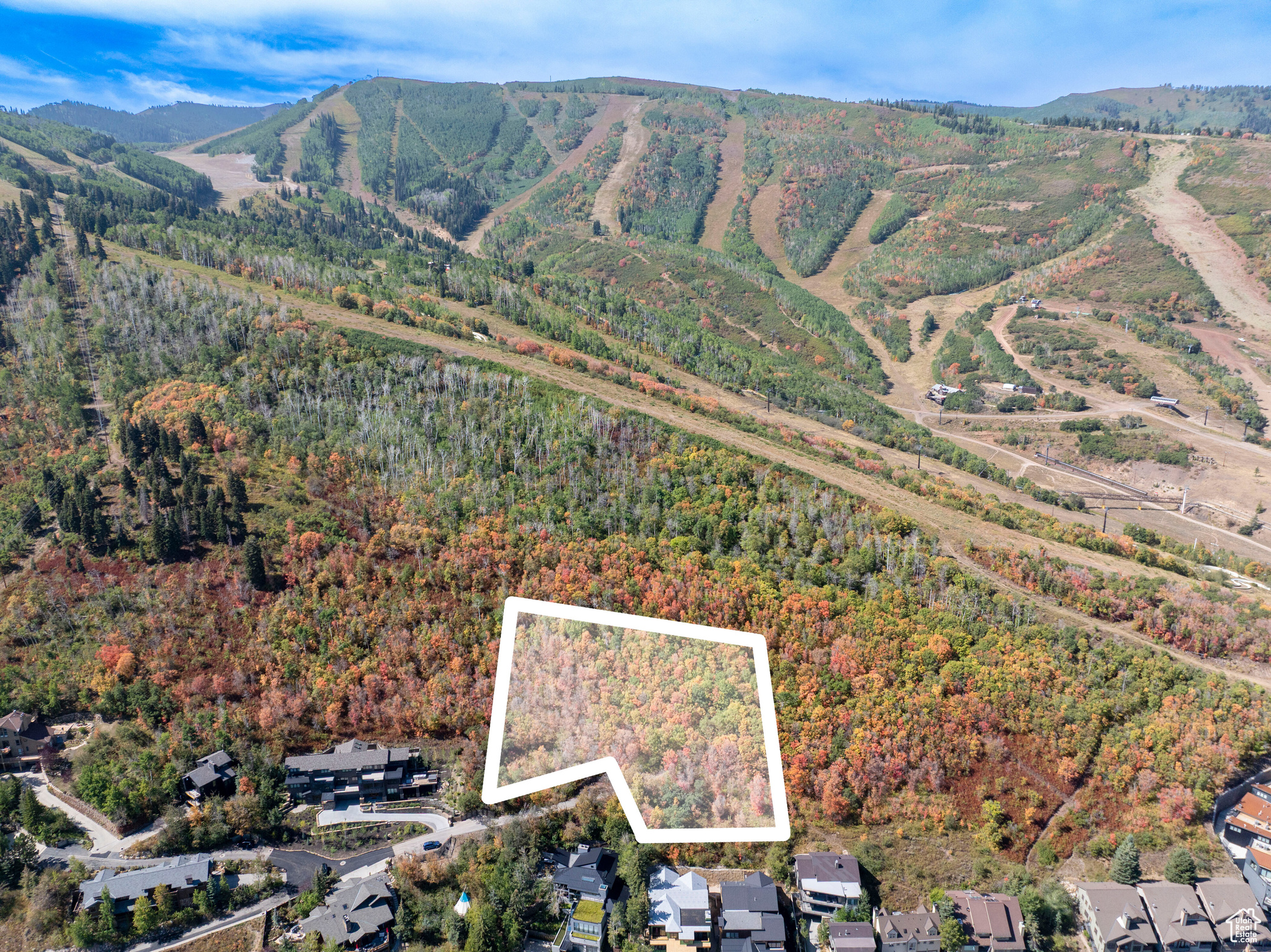 Nestled high on the slopes of Park City Mountain Resort, this 1.44-acre estate parcel is among the most extraordinary opportunities to come to market in the Wasatch Back. Positioned on a private road within an intimate seven-residence subdivision, the property is uniquely framed by mature evergreens and aspens, and it backs up to the King's Crown conservation easement, a preserved open space parcel through Summit Land Conservancy. From its elevated vantage, the homesite captures panoramas of storied Old Town, Deer Valley, and the town of Park City. While only steps from the resort's base area and the vitality of Main Street, the setting feels worlds away-private, sheltered, and singularly rare. Tucked away in a private and intimate enclave, the parcel offers the potential to create a truly landmark mountain residence, with the opportunity for an accessory building, subject to City approval. For the discerning buyer, this is not simply land, but an irreplaceable canvas on which to craft a generational retreat. Parcels of this caliber-combining size, privacy, direct resort adjacency, and protected views-are vanishingly rare, not only in Park City but across the world's most celebrated ski destinations. 1037 Northstar represents a singular chance to secure a piece of mountain history and to shape a home that will stand as a legacy for decades to come. Buyer to verify all information.