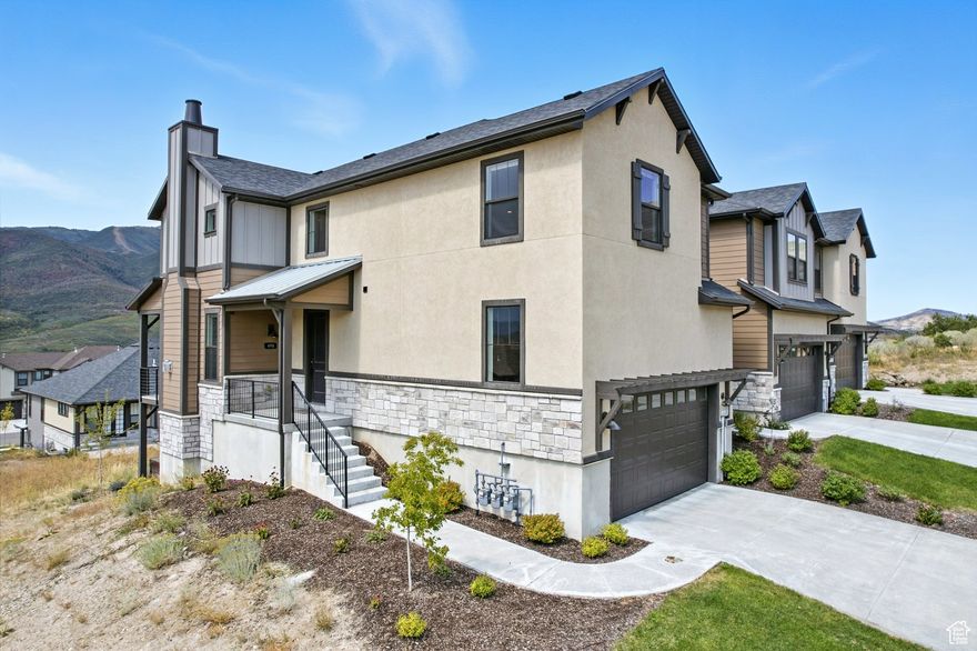 Set against the stunning backdrop of Mt. Timpanogos and Deer Creek Reservoir, this residence presents a rare opportunity to own a nightly rentalapproved home just minutes from Deer Valley's exclusive new East Village and twenty minutes from Park City's Historic Main Street. Designed for sophisticated mountain living, the open floor plan is enhanced by upgraded finishes and seamless indoor-outdoor flow. From the expansive deck, unwind in the private hot tub as the sun sets over panoramic valley and mountain views, a setting that feels both restorative and unforgettable. Inside, a serene primary suite, walkout lower level, and multiple gathering areas blend comfort with luxury. Note the high-end furnishings and appliances, all included with a strong offer. Take advantage of this one being completely turnkey-ready for ski season rental income or immediate personal enjoyment. With your HOA-managed landscaping and snow removal, ownership is effortless, allowing you to arrive and embrace proximity to the Park City lifestyle. A rare opportunity to own a luxury townhome with proven rental appeal in one of Utah's most sought-after destinations