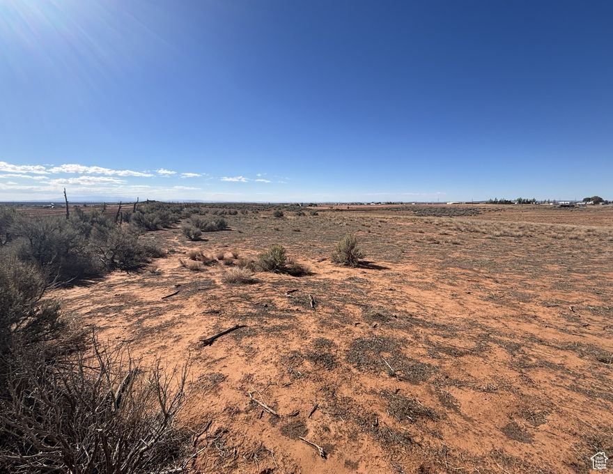 Step into the quiet beauty of San Juan County with this 9+ acre parcel just beyond the Blanding city limits. Out here, you'll have the space and freedom to create the lifestyle you've been dreaming of-whether that's a small farm, a ranchette, or simply a private getaway. From the land, you'll take in sweeping views of the Sleeping Ute and Abajo Mountains, with the Bears Ears Butte standing proud in the distance. The ground slopes gently, making it easy to explore, build, and put the land to work. This is the kind of place where you can set up an off-grid home, raise animals, plant a garden, and still have room left over for barns, corrals, or wide-open pasture. It's peaceful, private, and close enough to town for convenience, yet far enough to feel like your own world.