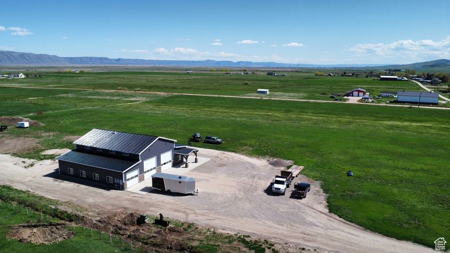 Seller financing available with negotiable terms! Price improved on this must see 74x60 ft Barndominium with 10 acres in the serene farming community of Bloomington Idaho. Just a short drive to Bear Lake or the national forest. The 10 acres borders two city roads and has development potential. Main level consists of a 3 bay workshop/ toy storage area. Also on the main is a spacious office with separate entrance, kitchen and full bathroom. Overlooking the workshop area is an amazing living space with two large rooms. Barndo is wired to run off the electrical grid or a generator if the power goes out.  Big shop doors are 12x14ft and the smaller one is 10x10ft.  Come make some memories at Bear Lake.  Contact listing agent for more info and to schedule your showings    Square footage figures are provided as a courtesy estimate only.  Buyer is advised to obtain an independent measurement. Priced $75,000 below appraised value