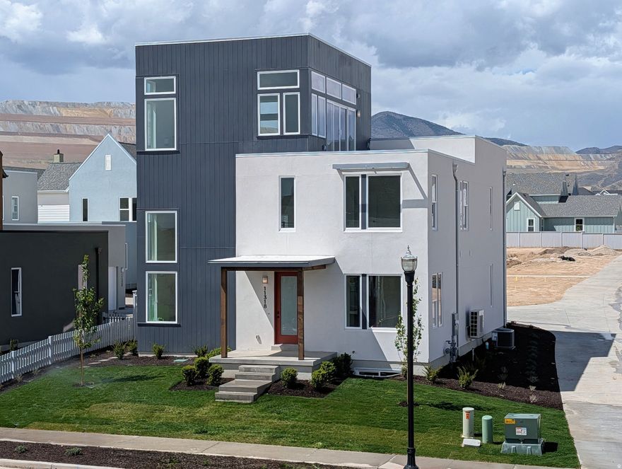 3% Preferred Lender incentive! Move-In Ready,Incredible Brand-New Innovator Sky home nearing completion! This show stopper home boasts a Sky Room on the 3rd level with gorgeous views and a hot-tub ready Sky Deck perfect for entertaining. Upgrades throughout such as quartz countertops, gas range, upgraded cabinetry, hard surface flooring, modern railing, gas fireplace and more. The open floor plan features a generous great room that flows seamlessly into the dining area and kitchen, and a main level office. Fenced backyard and room to grow in the basement! Located in the desirable Watermark Village in Daybreak with easy access to the watercourse! Estimated April 2026 completion. Photos are of actual home.