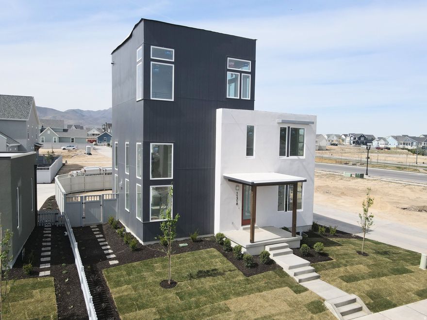 3% Preferred Lender incentive! Move-In Ready,Incredible Brand-New Innovator Sky home nearing completion! This show stopper home boasts a Sky Room on the 3rd level with gorgeous views and a hot-tub ready Sky Deck perfect for entertaining. Upgrades throughout such as quartz countertops, gas range, upgraded cabinetry, hard surface flooring, modern railing, gas fireplace and more. The open floor plan features a generous great room that flows seamlessly into the dining area and kitchen, and a main level office. Fenced backyard and room to grow in the basement! Located in the desirable Watermark Village in Daybreak with easy access to the watercourse! Estimated April 2026 completion. Photos are of actual home.