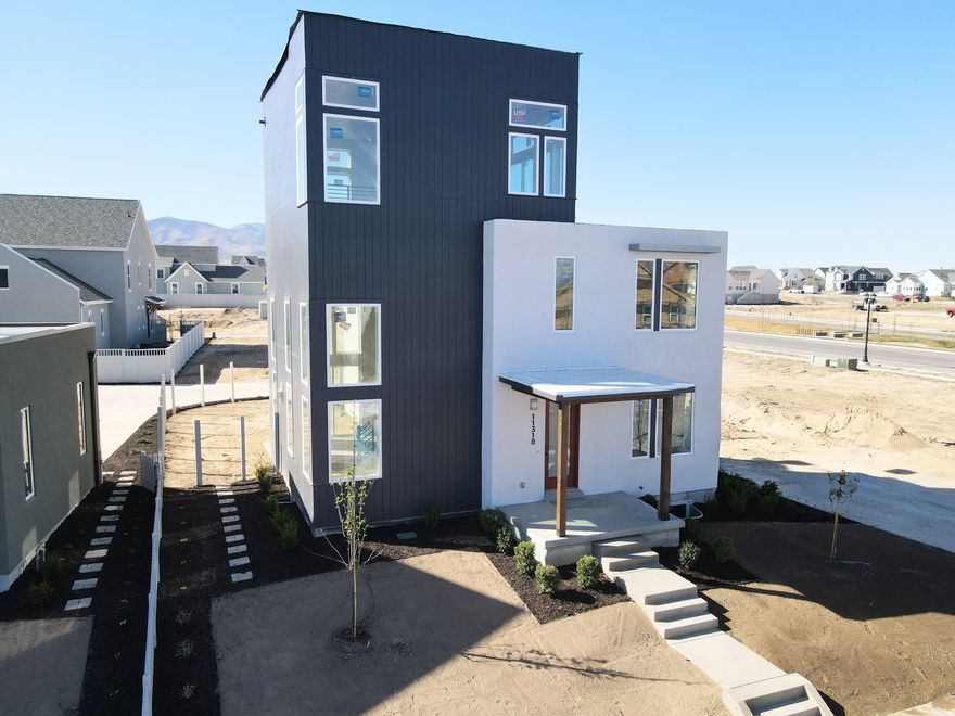 3% Preferred Lender incentive! Move-In Ready,Incredible Brand-New Innovator Sky home nearing completion! This show stopper home boasts a Sky Room on the 3rd level with gorgeous views and a hot-tub ready Sky Deck perfect for entertaining. Upgrades throughout such as quartz countertops, gas range, upgraded cabinetry, hard surface flooring, modern railing, gas fireplace and more. The open floor plan features a generous great room that flows seamlessly into the dining area and kitchen, and a main level office. Fenced backyard and room to grow in the basement! Located in the desirable Watermark Village in Daybreak with easy access to the watercourse! Estimated April 2026 completion. Photos are of actual home.