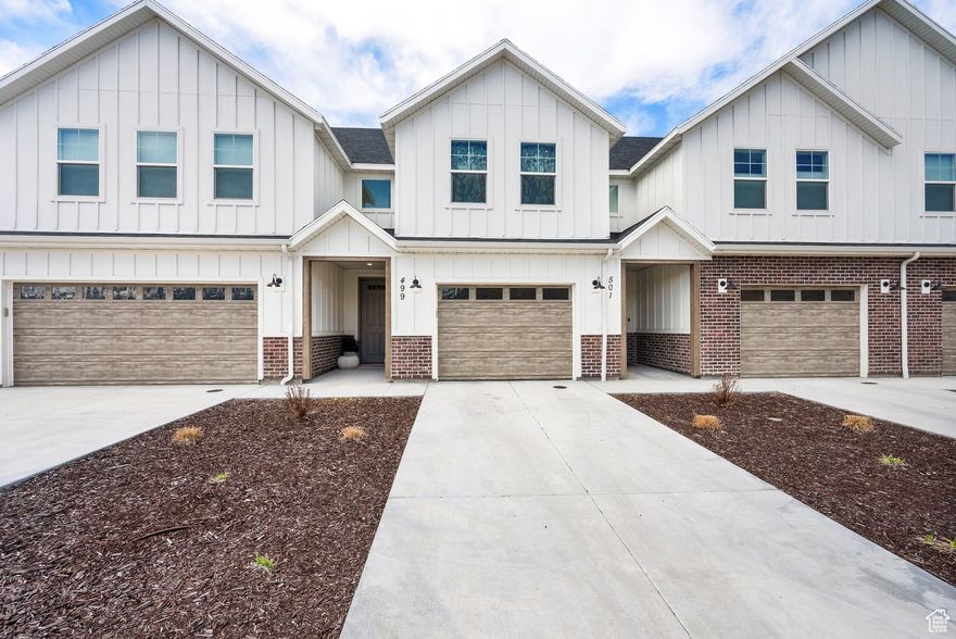 Welcome to this barely-lived-in, like-new 2-story townhome, offering both comfort and convenience in a quiet, small neighborhood setting. Situated on a desirable middle lot, this home boasts an XL 1-car garage and a fully fenced yard, providing both privacy and space for outdoor enjoyment.  Inside, you'll find numerous upgrades that elevate the living experience. The kitchen features a large walk-in pantry, a stylish farm sink, and gorgeous quartz countertops-perfect for cooking and entertaining. The main level includes durable LVP flooring and upgraded carpet, creating a sleek, modern look throughout.  The spacious floor plan offers a welcoming loft area, ideal for a home office or second living space. The primary suite includes a generous walk-in closet, while the 9' ceilings throughout enhance the sense of openness. 180 degree mountain views from master bedroom. Additionally, there's a full-size laundry room and plenty of storage throughout the home. Light dimmers are installed throughout the property, allowing you to create the perfect ambiance for any occasion.  Enjoy the added benefit of 1 GB fiber internet, included in the HOA, perfect for streaming, remote work, or gaming. Plus, the washer, dryer, refrigerator, and even a 70-inch TV are all included-making this home truly move-in ready!   With more than ample parking for the community, this townhome offers convenience and ease. Additional furniture is negotiable, offering you even more flexibility in making this home your own.  Don't miss your chance to live in this peaceful, well-maintained neighborhood with all the upgrades and amenities you could want!