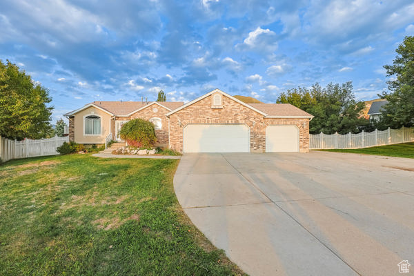 Come and experience the serene living this exceptional home with a gorgeous view has to offer. Located in a quiet cul-de-sac right off Skyline Drive, this home sits on .43 acres of fully fenced and landscaped land. This layout offers 2 SEPERATE living spaces. Live in the upstairs and rent out the downstairs for additional income!!! Upstairs includes an updated white kitchen with silestone counters, vaulted ceilings, gas stove, stone sink, a breakfast bar with seating for 5, silent closing drawers, glass display cupboards, LED under cabinet lighting, a built in desk, and as many cabinets as you'll ever need! It overlooks the large family room with access to your backyard oasis complete with concrete patio, landscape boulders, shade trees, an area for a large garden, seperate basement entrance, double gates, and access from the backyard to pull in and store your off road toys or add a greenhouse. RV parking and circle parking ensure many people can occupy this space comfortably. The large master suite has attached master bathroom with garden tub/separate shower as well as a 10'x20' deck with beautiful mountain, valley, and lake views! The basement is an on-suite apartment with 2nd kitchen, dining room, 2 bedrooms, bathroom, and separate laundry. There is also a huge storage room that can be finished into an additional living room. Water softener plus 2 furnaces to heat/cool separate levels of the home! 40 year roof was installed at the end of 2018. Square footage figures are provided as a courtesy estimate only. Buyer is advised to obtain an independent measurement