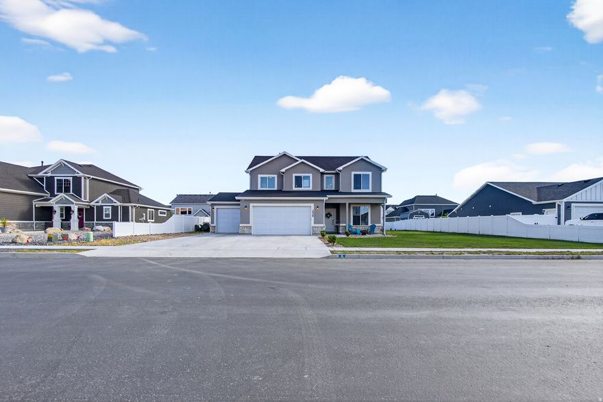 Built in 2023, this two-story home sits on a finished street in a newer Farr West community where surrounding construction is complete and landscaping is already in place-no waiting on the neighborhood to catch up. The main level includes a dedicated office or flex space with glass french doors, half bath, and a mudroom just off the oversized 4-car garage. The kitchen is equipped with a gas range, soft close cabinets, a large breakfast island, and opens to the living area with a gas fireplace, sliding glass doors to the backyard, creating a practical layout for both everyday living and hosting. Upstairs, the primary suite includes a walk-in closet and ensuite bath, along with a second family room that provides separation from the main living space. Three additional bedrooms, a full bathroom, laundry room and closet space complete the upper level. Set on a 0.27-acre lot, the yard is fully irrigated with partial fencing already in place. The garage stands out with extra height and depth, plus a wide driveway and side space suitable for RV or trailer parking. Fiber optic wiring is already installed for high-speed connectivity, plus a dedicated interior switch that powers an exterior roofline outlet, ideal for seasonal or permanent lighting. Positioned with clear views of Ben Lomond Peak and convenient access to 2700 North, commuting is straightforward with a direct route to Hill Air Force Base and the retail expansion nearby, including the new Target development just across the interstate. Move in and take advantage of the space, views, and convenience already in place.  *Square footage figures are provided as a courtesy estimate only and were obtained from county records. Buyer is advised to obtain an independent measurement. Buyer and Buyer's representative should do their own due diligence, all information is provided as a courtesy and to the best of knowledge of the selling brokerage. Selling brokerage shall not be held liable.