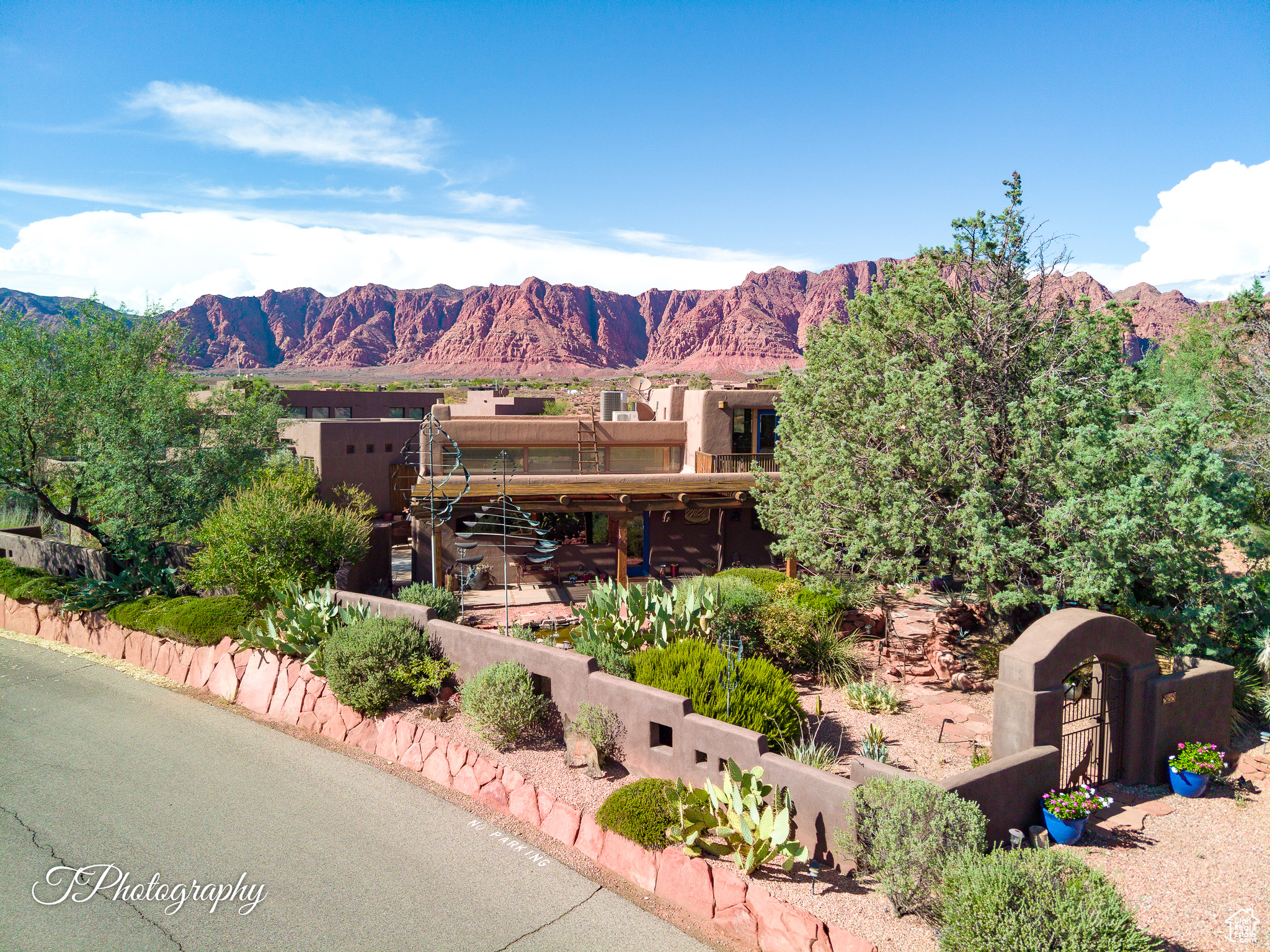 Coveted RESIDENCE/NIGHTLY RENTAL in Kayenta's Art Village (commercial district). Former Wind Sculpture Studio has one of a kind warehouse/loft/industrial vibe. Sale includes adjoining .33 acre (residential/Shonto HOA) building lot. Think Canyon Road in Santa Fe, Old Town Park City, Village Center Sundance. So many possibilities with this bespoke property in Kayenta. The main house features main floor owners quarters: family room, kitchen, laundry, primary bedroom, bath, guest bedroom and a huge great room with wet bar and room for office, media, studio or whatever you heart desires. Upper level is a studio apartment with separate entry, Full bath, kitchenette and fantastic views from the upper deck. The detached Casita was built in 2015 and includes great room, full kitchen, a generous primary bedroom with a killer en-suite bath. Outside, lush courtyards abound. Mature landscaping and artful southwest details make this a truly timeless and rare find. If there is a unicorn in Kayenta...this is it! 888 is being sold turnkey, with furnishings and furniture included. Some personal items and one WIND SCULPTURE EXEMPT. This property has long been a favorite with the nightly rental crowd. The Main House and Casita are located on a commercial-zoned lot. The main house easily sleeps eight. The casita could sleep four. Perfect for artists looking for live/work studio space and rental income. Or residential owners who would like to use short-term rentals for additional income. Rent the entire commercial property and build your home on the residential lot with the rental income from the commercial property. The Coyote Gulch Commercial is in the process of creating an HOA. Details forthcoming. Being sold with a lot to the north: Lot I-SHO-6-B-133, 33-acre residential zoning in Shonto HOA. The yearly HOA fee in Shonto HOA is $700. Both properties are current Kayenta Recreation Association members.