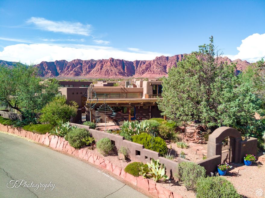 Coveted RESIDENCE/NIGHTLY RENTAL in Kayenta's Art Village (commercial district). Former Wind Sculpture Studio has one of a kind warehouse/loft/industrial vibe. Sale includes adjoining .33 acre (residential/Shonto HOA) building lot. Think Canyon Road in Santa Fe, Old Town Park City, Village Center Sundance. So many possibilities with this bespoke property in Kayenta. The main house features main floor owners quarters: family room, kitchen, laundry, primary bedroom, bath, guest bedroom and a huge great room with wet bar and room for office, media, studio or whatever you heart desires. Upper level is a studio apartment with separate entry, Full bath, kitchenette and fantastic views from the upper deck. The detached Casita was built in 2015 and includes great room, full kitchen, a generous primary bedroom with a killer en-suite bath. Outside, lush courtyards abound. Mature landscaping and artful southwest details make this a truly timeless and rare find. If there is a unicorn in Kayenta...this is it! 888 is being sold turnkey, with furnishings and furniture included. Some personal items and one WIND SCULPTURE EXEMPT. This property has long been a favorite with the nightly rental crowd. The Main House and Casita are located on a commercial-zoned lot. The main house easily sleeps eight. The casita could sleep four. Perfect for artists looking for live/work studio space and rental income. Or residential owners who would like to use short-term rentals for additional income. Rent the entire commercial property and build your home on the residential lot with the rental income from the commercial property. The Coyote Gulch Commercial is in the process of creating an HOA. Details forthcoming. Being sold with a lot to the north: Lot I-SHO-6-B-133, 33-acre residential zoning in Shonto HOA. The yearly HOA fee in Shonto HOA is $700. Both properties are current Kayenta Recreation Association members.