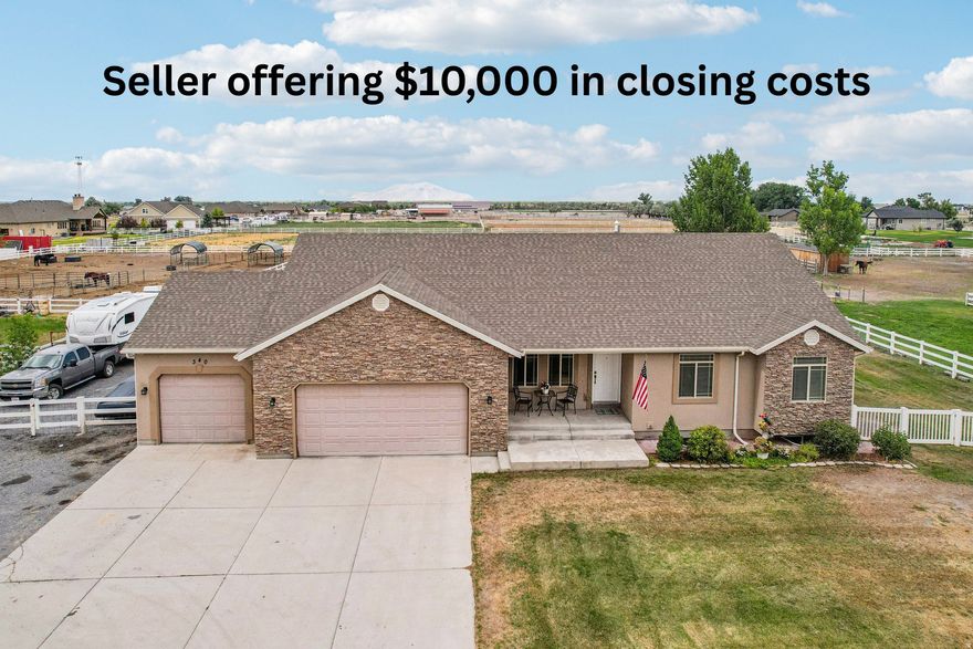 Seller is offering $10,000 in closing costs. Welcome to your dream home, where space, comfort, and charm come together on 1.17 acres of peaceful, no-HOA living. This beautiful 6-bedroom, 3-bath home offers nearly 4,000 square feet of thoughtfully designed space, ideal for both everyday living and fun gatherings. The fully finished basement is an entertainer's delight, featuring a cozy movie theater room, a wet bar, and an adorable playhouse tucked beneath the stairs. A spacious 3-car garage plus ample extra parking provides room for RVs, toys, and all your hobbies.  Step outside and enjoy evenings by the firepit with swinging benches, collect fresh eggs from the chicken coop, or take in the night sky from your very own observatory. Inside, you'll love the warmth of two fireplaces, the efficiency of a whole-house fan for rapid cooling, and recent upgrades, including two new 50-gallon water heaters. Upstairs offers four generously sized bedrooms, one ideal for a home office, and a relaxing primary suite with a walk-in closet and private bath featuring a separate tub and shower. Additional highlights include a covered deck for relaxing or entertaining, space for animals, one water share included, and permanent holiday lighting for year-round curb appeal. This isn't just a home-it's a lifestyle and a place where memories are made.