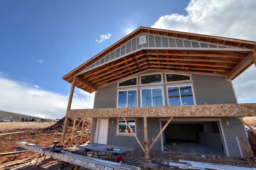 New construction with a large covered front deck capturing beautiful views of Bear Lake. This home features vaulted ceilings, a fireplace, four bedrooms, and three full bathrooms. Extra-deep garage offers great storage for all your toys. Buyers still have the opportunity to make some of the finish choices.