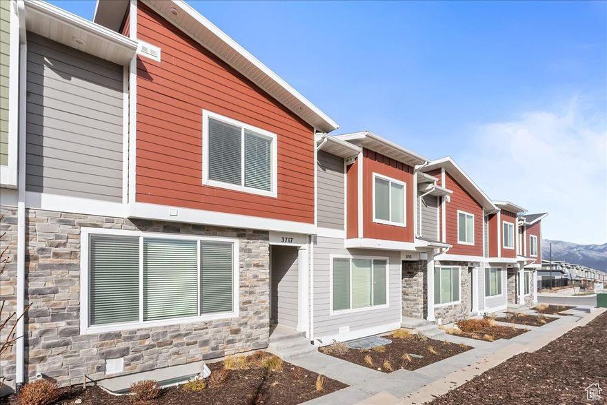 $5,000 IN CLOSING COSTS OR 1 YEAR RATE BUY DOWN WITH PREFERRED LENDER! Move-in ready and better than new! This beautifully finished townhome is packed with upgrades and designed for both comfort and style. The inviting living area centers around a modern fireplace, creating the perfect spot to relax or gather with loved ones. The open floor plan flows seamlessly throughout, while the fully finished basement offers endless possibilities, whether you need an extra en suite bedroom, spacious family room, private home office, or home gym. Enjoy resort-style living with community amenities including a pool, spa, fitness center, clubhouse, and pickleball courts. Unlike many units, this home also offers a rare 2-car driveway in addition to the 2-car garage, providing plenty of parking and convenience. Tucked in a prime location just minutes from Mountain View Corridor, with shopping, dining, and entertainment at your fingertips, this home truly has it all! Buyer/Broker to verify all.