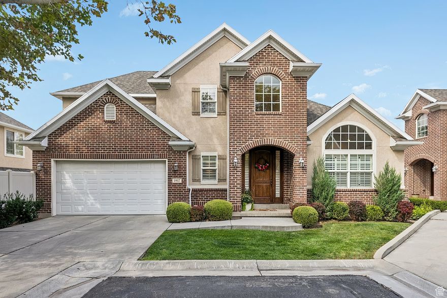 Located in the gated Holladay Oaks community, this elegant two-story home sits among mature trees and lush landscaping, creating a rare park-like setting in the heart of Holladay. With nearly 4,000 square feet, the home offers 5 bedrooms, 3.5 bathrooms, and multiple gathering spaces designed for both relaxation and entertaining. *** The main level welcomes you with vaulted ceilings, abundant natural light, and an open flow between the family room, dining area, and kitchen. Upgraded finishes throughout the home add warmth and timeless sophistication.  The kitchen is the home's centerpiece, featuring a large island, bar seating, and gas range. The main-floor primary suite offers a private retreat with walk-in closet and spa-like bath, complete with dual sinks, oversized shower, and jetted tub. *** Upstairs, a cozy family room pairs with two bedrooms and a full bath. The lower level extends the living space with another family room, two bedrooms, a full bath, and a versatile bonus room, which would be ideal for an office, gym, or creative studio space. *** Outside, the front of the home opens to beautifully landscaped grounds, with mature trees and community spaces that feel like an extension of your own yard. In back, a private deck and patio offer a serene retreat, perfect for morning coffee, evening gatherings, or simply unwinding in the shade. Additional features include plantation shutters, central vacuum, and a smart thermostat. The community provides gated access, snow removal, and exterior maintenance for a truly effortless lifestyle. *** Walk to Caputo's for gourmet sandwiches, or head to 3 Cups for your caffeine fix. With Holladay's town center, the new Holladay Hills development, top area schools, the Lions Rec Center, and freeway access nearby, this home offers both tranquility and convenience.