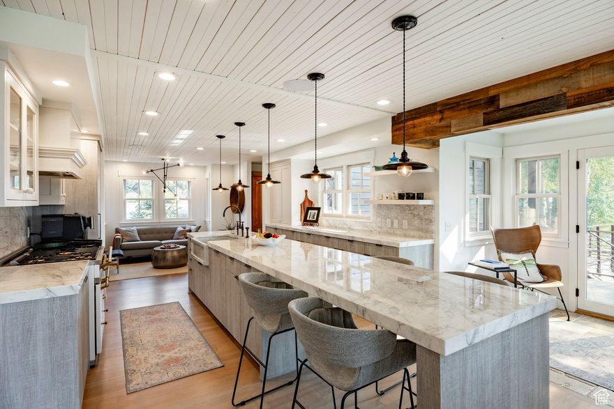 Welcome to 347 McHenry Avenue, a rare Old Town gem that combines privacy, space, and modern comfort with the soul and character that make Park City homes so special. Tucked into a quiet cul-de-sac on five Old Town lots, this 4,461 sq. ft. residence offers a peaceful retreat just steps from Main Street and moments from Deer Valley and Park City Mountain Resort. The home's heated driveway and walkway, flat approach, and two-car epoxy garage with built-in storage and workspace ensure ease and convenience year-round. Freshly painted exterior and updated landscaping create a welcoming first impression, while the wraparound deck-with sweeping views of Old Town and the ski resort-sets the stage for mountain living at its finest. Enjoy evenings by the wood-burning fireplace or soak in the hot tub as you watch the lights of the resort sparkle against the valley backdrop. Inside, you'll find five bedrooms and 5.5 baths, including a private lockout suite above the garage with its own entrance and bathroom-perfect for guests or flexible use. The warm, inviting interior blends modern upgrades with timeless charm. Multiple gathering spaces, an in-home gym and cycling room, motorized shades, and upgraded storage make the home as functional as it is beautiful. Upstairs bedrooms feature brand-new mini split A/C units for year-round comfort. McHenry Avenue offers what few Old Town locations can: privacy, quiet, and space-all within a short stroll down the stairs to Main Street. Adjacent to a pocket park and surrounded by panoramic views of the valley, ski slopes, and historic Old Town, this property provides a serene mountain lifestyle without sacrificing access to world-class dining, shopping, and skiing. If you've dreamed of a home that captures the best of Park City-character, convenience, and seclusion-347 McHenry Avenue delivers it all. This is more than a home; it's your private mountain retreat in the heart of Old Town.