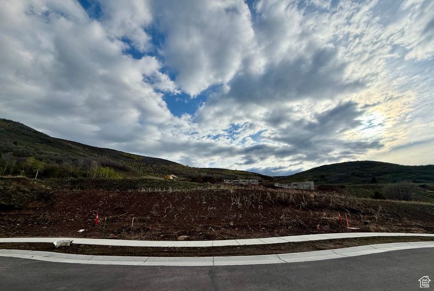 SELLER MOTIVATED! Nightly Rental Approved. Nestled at the end of a quiet cul-de-sac in the sought-after Benloch Ranch community, this premium lot offers the ideal setting for your mountain retreat. Enjoy peace, privacy, and panoramic views from this ready-to-build homesite, with architectural plans and designs pre-drawn saving you time and hassle.  Experience tranquil mountain living just minutes from world-class amenities. You're a short drive from East Village Deer Valley and Jordanelle Reservoir, making year-round recreation easily accessible.  Whether you're looking to build your dream home or a high-end getaway, this lot combines seclusion with convenience in one of Utah's most desirable up-and-coming communities.
