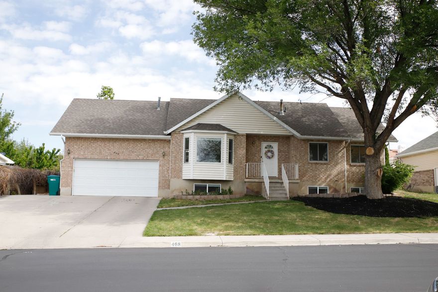 Here is a great home with six bedrooms, new high efficiency windows and new carpet. The HVAC system was recently replaced with a high efficiency furnace, so between the new windows and furnace, the home stays cool or warm as you desire. The yard has a mix of mature trees, flowering trees and fruit trees. There is a raised garden bed section, too. The neighborhood is wonderful and has a short walk to Centennial Park and is close to the schools. Home is located a short walk, just around the corner, from the entrance to Centennial Park where there is a great asphalt track for running or letting the children ride their bikes or scooters. There is NO HOA in this neighborhood!  Don't miss out, come see for yourself the benefits of this home and community have to offer.