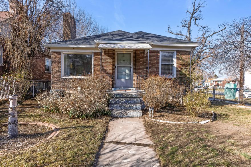 The home has been lovingly maintained over the years. As you enter the foyer, you'll find a cozy living room featuring a wood burning fireplace and a large picture window looking at Capitol Hill. Adjacent to the living room is the dining room, which flows seamlessly into the galley style kitchen with quartz countertops, subway tile backsplash and all appliances are included. There are two entrances into the private hallway that lead to to one bathroom, two bedrooms, original built ins and closet for linens and pantry, and even a phone shelf! The downstairs can remain part of the main house or be closed off to create an income-producing ADU!! With two basement entrances, there is a third bedroom, another full bathroom, an eat-in kitchen and a laundry area. Off the family-room, or possible 4th bedroom, is an oversized storage space that was once the coal bin for this 1940s house, that is perfect for storing holiday decorations, outdoor equipment, and more. The outdoor space is an ideal charming backyard. The property features an apple tree, an Italian plum tree, blush grape vines, blackberry shrubs and currants. The backyard also has a large garden space for colorful summer flowers. A one-car garage offers shelving for organizing any hobbyist or outdoor enthusiast. This home boasts several upgrades, including new roof (2024), and an updated furnace (2021).