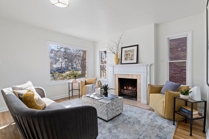 The home has been lovingly maintained over the years. As you enter the foyer, you'll find a cozy living room featuring a wood burning fireplace and a large picture window looking at Capitol Hill. Adjacent to the living room is the dining room, which flows seamlessly into the galley style kitchen with quartz countertops, subway tile backsplash and all appliances are included. There are two entrances into the private hallway that lead to to one bathroom, two bedrooms, original built ins and closet for linens and pantry, and even a phone shelf! The downstairs can remain part of the main house or be closed off to create an income-producing ADU!! With two basement entrances, there is a third bedroom, another full bathroom, an eat-in kitchen and a laundry area. Off the family-room, or possible 4th bedroom, is an oversized storage space that was once the coal bin for this 1940s house, that is perfect for storing holiday decorations, outdoor equipment, and more. The outdoor space is an ideal charming backyard. The property features an apple tree, an Italian plum tree, blush grape vines, blackberry shrubs and currants. The backyard also has a large garden space for colorful summer flowers. A one-car garage offers shelving for organizing any hobbyist or outdoor enthusiast. This home boasts several upgrades, including new roof (2024), and an updated furnace (2021).