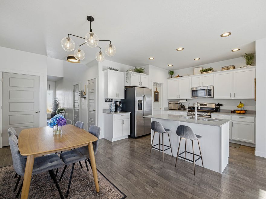 OPEN HOUSE SATURDAY 3/7/26 FROM 11AM-2PM! | This warm and inviting home features a spacious layout and is very budget friendly at $494,900! | The kitchen and family room are the heart of the home and feature a large island, quartz countertops, huge pantry, gas range, 9' ceilings, & wide plank laminate wood floors! | Newly updated light fixtures, fans &  bath give it a fresh and modern feel | Easy access primary suite on the main level with walk-in shower & closet make it the perfect retreat | The upstairs bedrooms are actually big with large windows and closets | Endless potential in large basement that is currently being used for storage & a home gym with framing for future great room, bathroom, & 5th bedroom | EV charging station installed in garage for your electric vehicles | RV pad on side of the house for toys and extra vehicles | Beautiful, fully fenced yard with perennial flowers, garden boxes, & fruit trees make a perfect private oasis | Wonderful neighborhood with pump track, grass park, & sledding hill right across the street and nearby pickleball courts, pool, farmer's markets, & trails great for biking and walking | Schools & newly planned shopping & amphitheater all within walking distance!