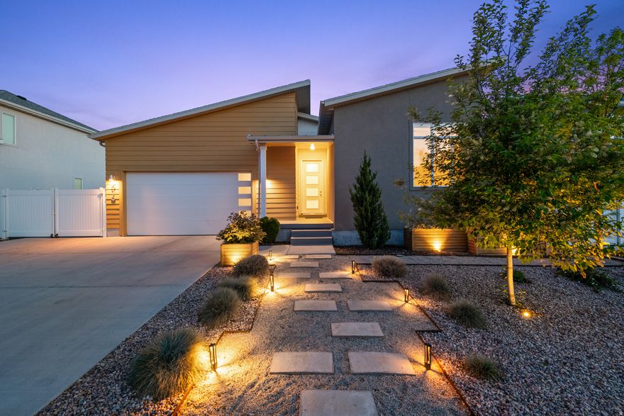 Beautifully situated in a newer Garbett Homes community in South Salt Lake on the historic site of former Granite High School, this thoughtfully upgraded home blends efficiency, design, and lifestyle. Just around the corner from the new Granite Library, enjoy easy access to parks, dining, and transportation.  Built for energy efficiency with owned solar panels, electric car charging outlet, air recovery system, reverse osmosis water filtration, and tankless water heater. Interior highlights include an upgraded gourmet kitchen, spacious primary suite with dual vanities, and a front bedroom/office with 10-foot ceiling.  The unfinished basement offers exciting future potential, including space for a possible basement apartment and separate entrance.  Outside, the owners have created beautiful curb appeal and a true backyard oasis with entertaining spaces, garden boxes, extra storage, and rare RV parking. A special opportunity in one of South Salt Lake's most exciting newer communities.    **Square footage figures are provided as a courtesy estimate only.  Buyer is advised to obtain an independent measurement.